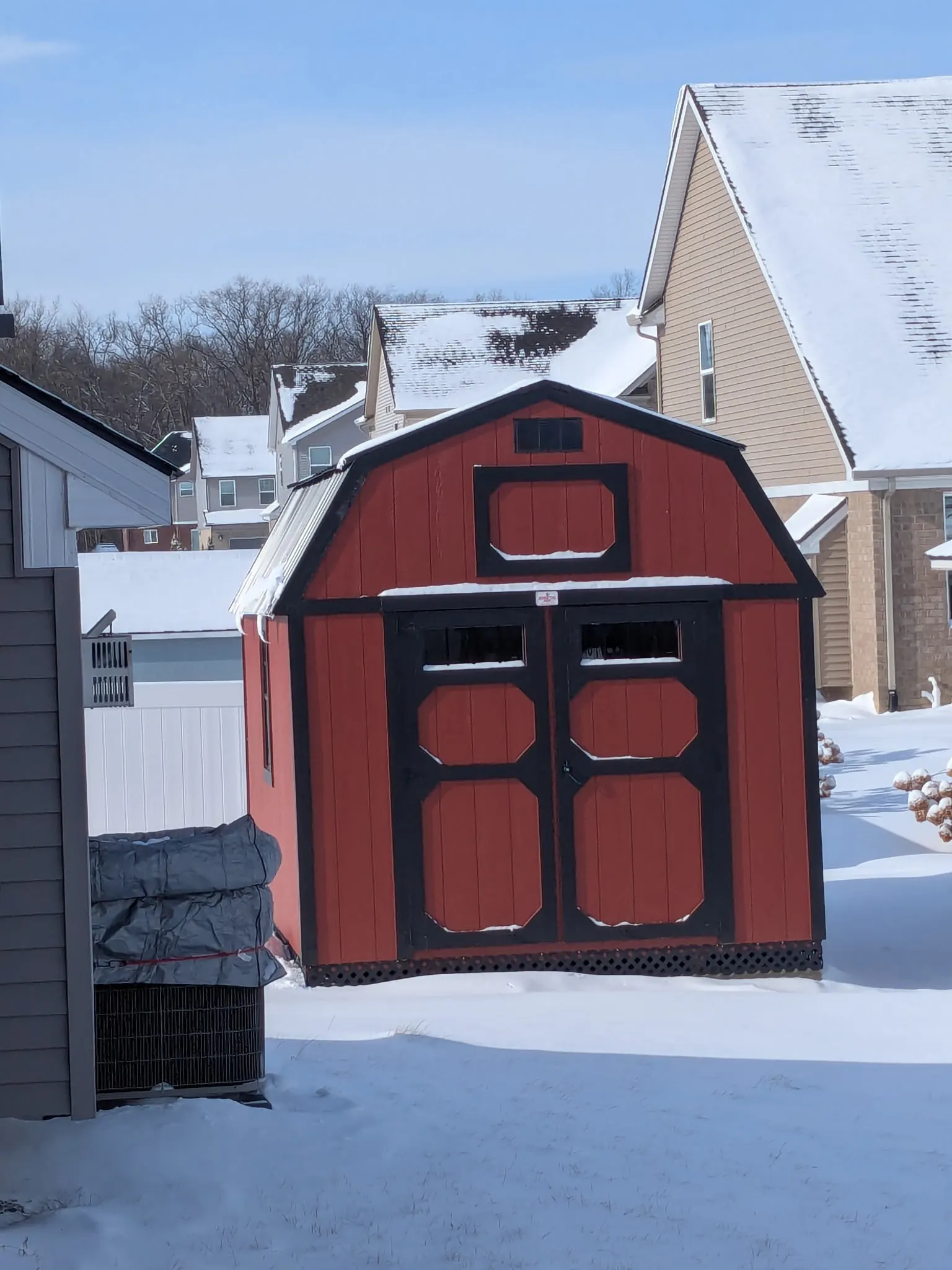 Red lofted barn standing through a Michigan winter