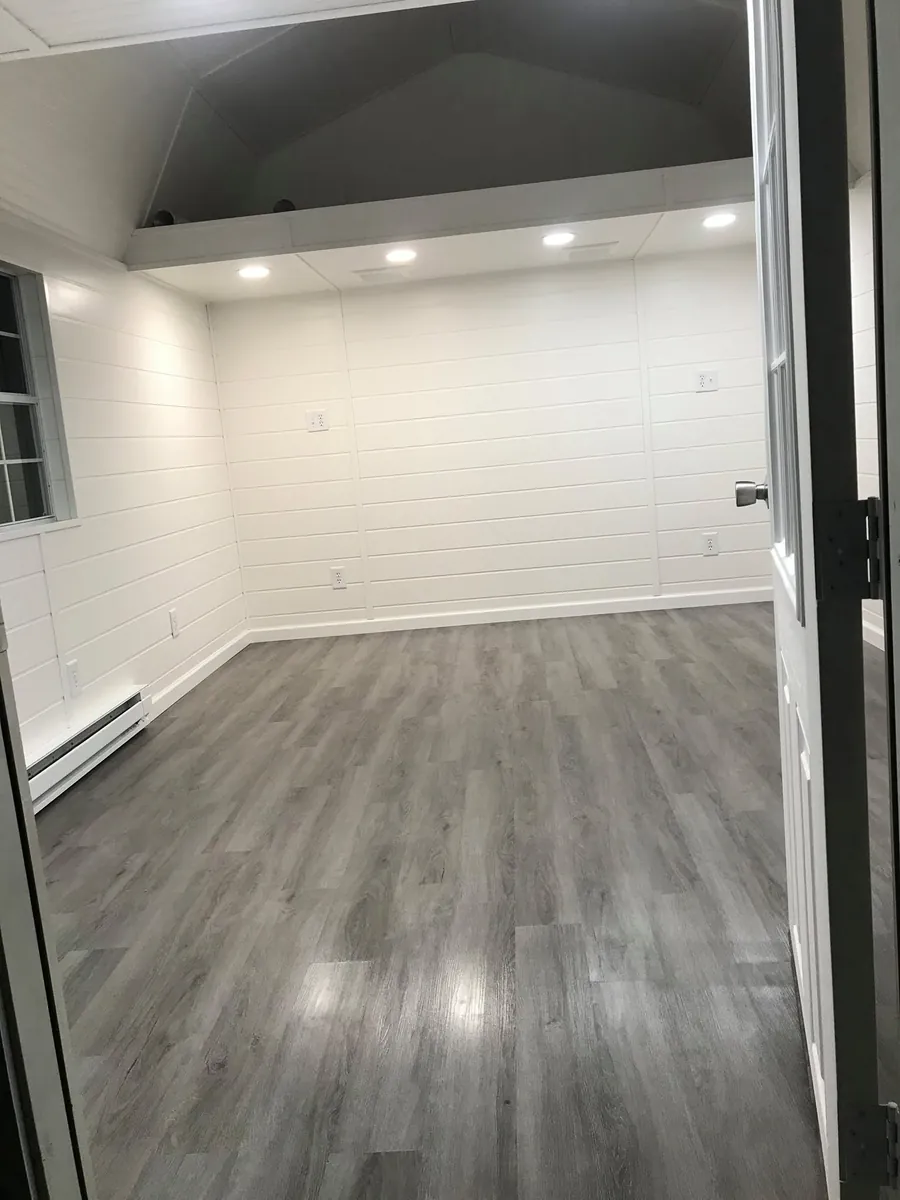 White/gray lofted shed exterior
